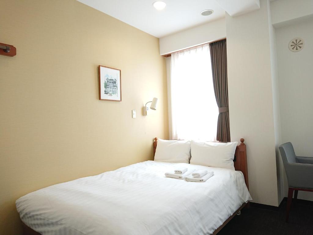 Krevet ili kreveti u jedinici u okviru objekta Smile Hotel Kobe Motomachi