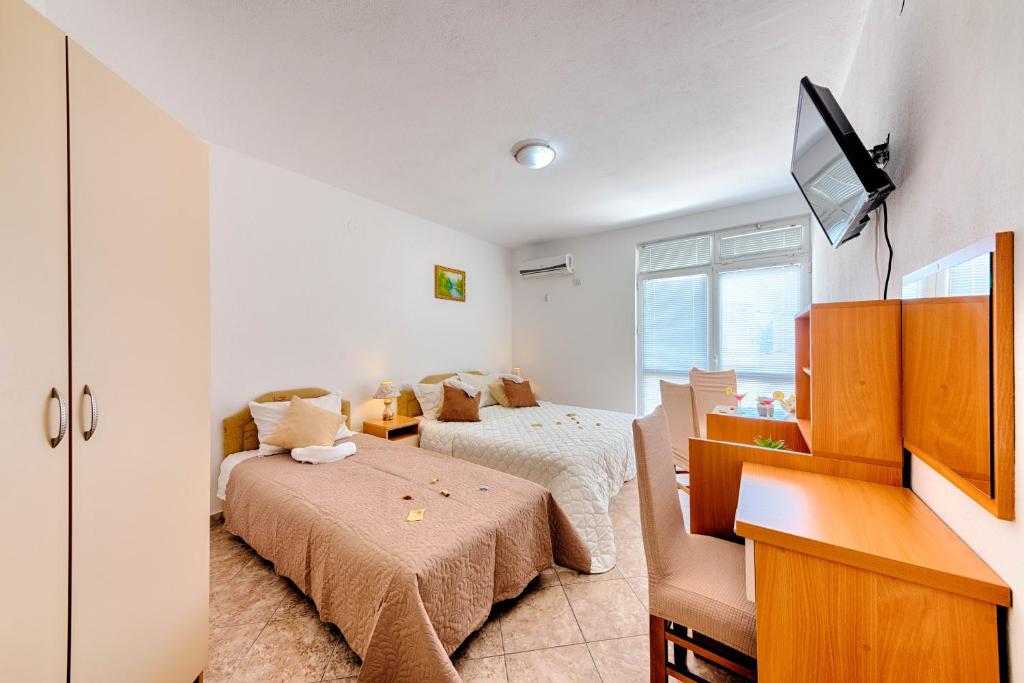 Postel nebo postele na pokoji v ubytování HOTEL DANA