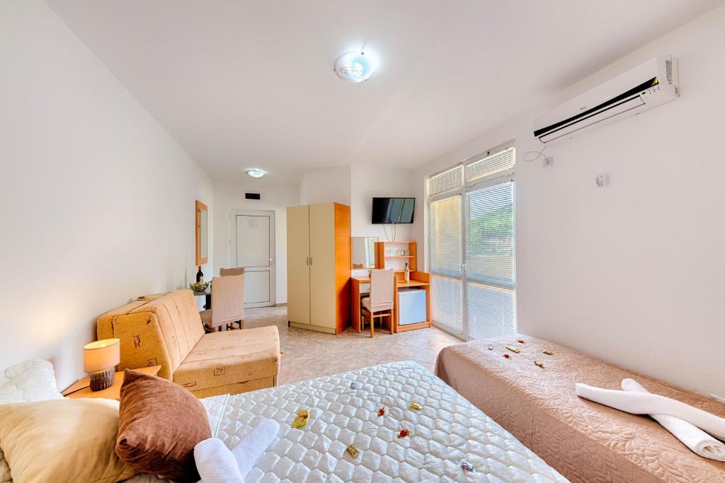 Postel nebo postele na pokoji v ubytování HOTEL DANA