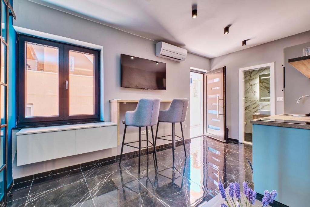 Televízia a/alebo spoločenská miestnosť v ubytovaní Luxury apartments