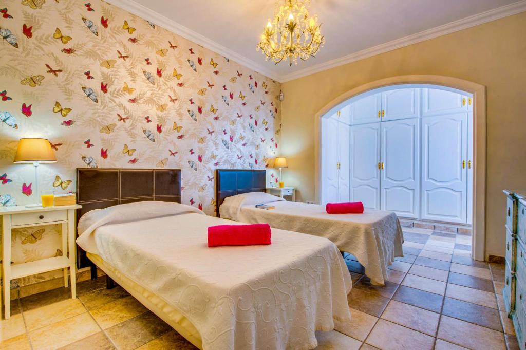 A bed or beds in a room at MARIA DEL RISCO by Buenavilla