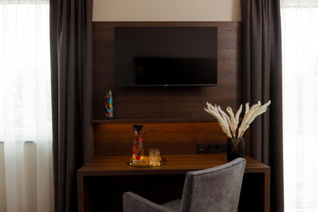 TV a/nebo společenská místnost v ubytování Herzl Hotel bei Erding