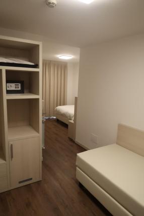 Postel nebo postele na pokoji v ubytování Hotel Riposo