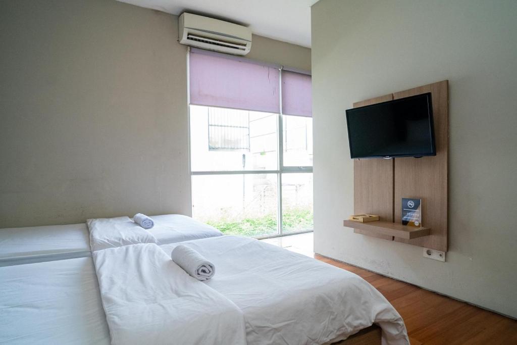 Postel nebo postele na pokoji v ubytování Three J Residence 2