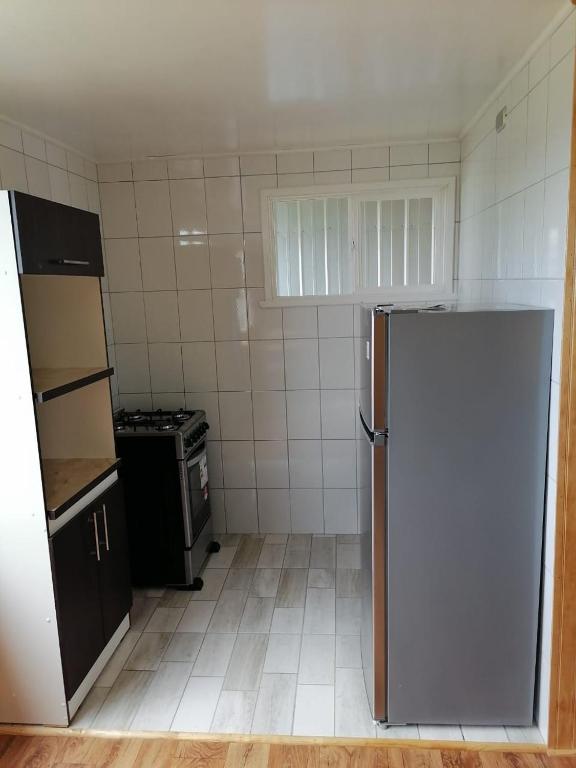 Kuchyň nebo kuchyňský kout v ubytování Cabaña María Quinchen