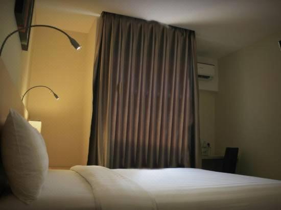 Postel nebo postele na pokoji v ubytování Biz Hotel Batam