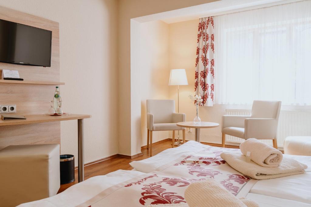 Postel nebo postele na pokoji v ubytování Hotel An den Bleichen