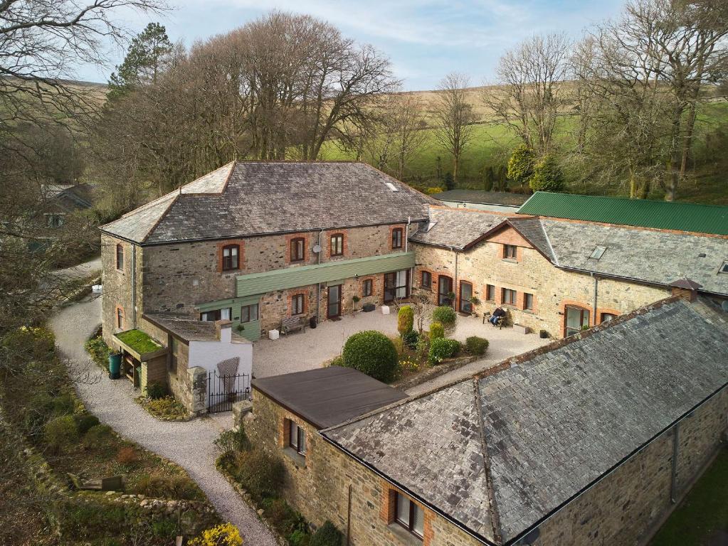 an aerial view of a large brick house at The Stable - The Cottages at Blackadon Farm in Ivybridge