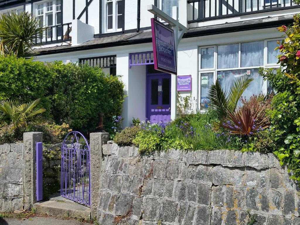 a house with a purple gate in front of it at Falmouth Lodge in Falmouth