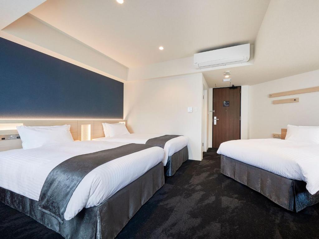 Postel nebo postele na pokoji v ubytování Hotel Keyaki Gate Tokyo Fuchu
