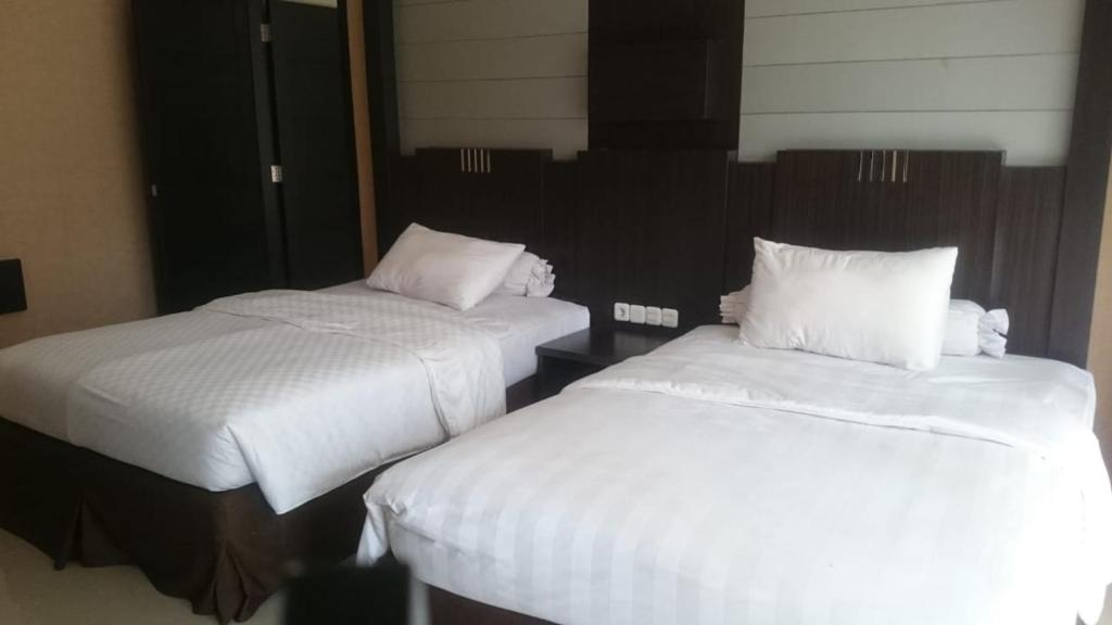 Postel nebo postele na pokoji v ubytování Batusuki Resort & Hotel