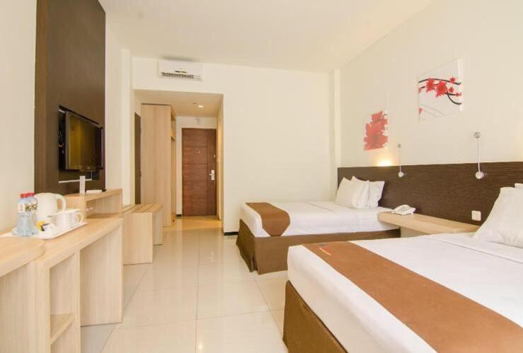 Postel nebo postele na pokoji v ubytování Batusuki Resort & Hotel
