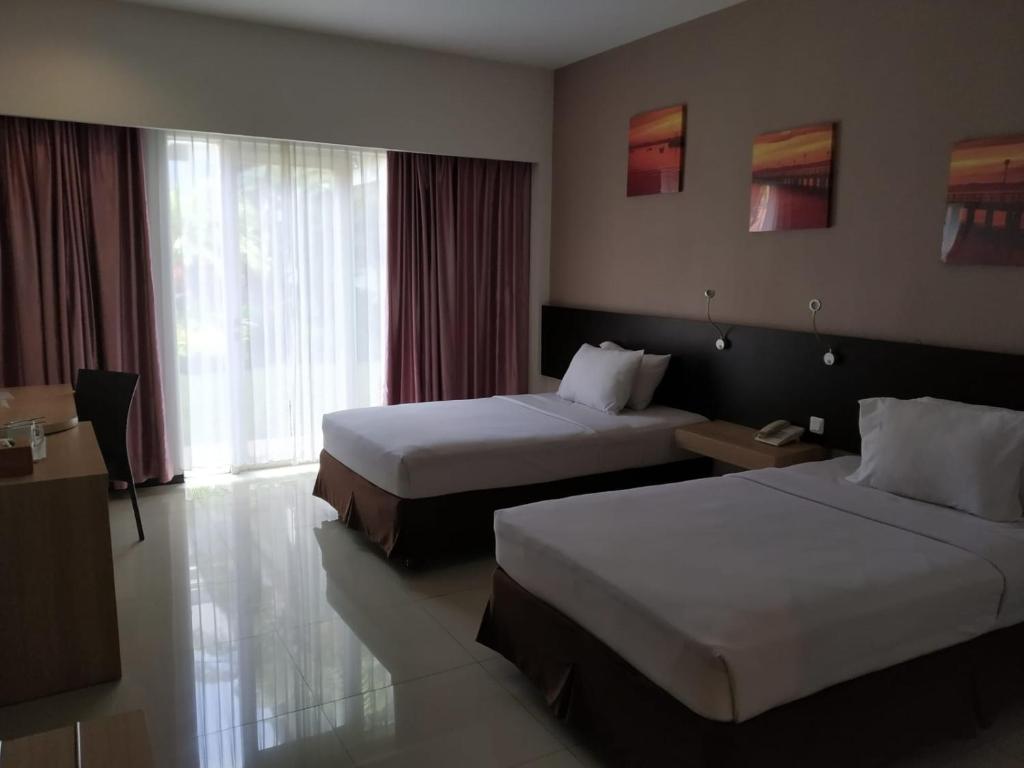Postel nebo postele na pokoji v ubytování Batusuki Resort & Hotel