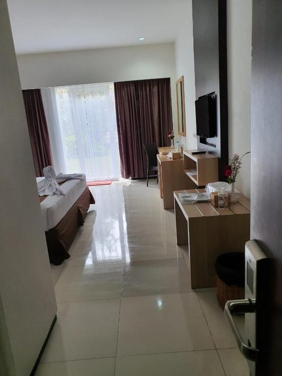 TV a/nebo společenská místnost v ubytování Batusuki Resort & Hotel