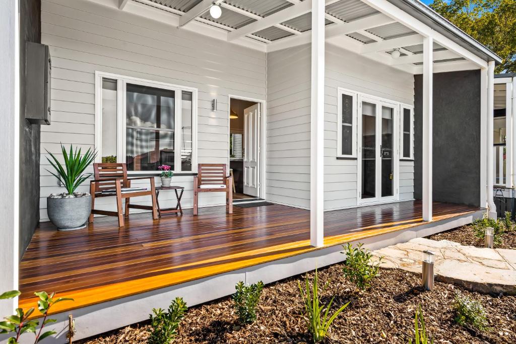 a deck with a pergola on a house at Bluestone Cottages - The Villa in Toowoomba