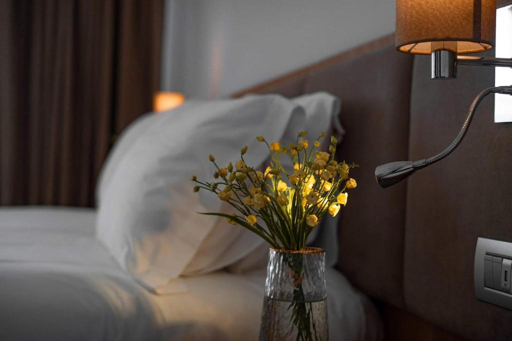 Postel nebo postele na pokoji v ubytování Amare Hotel
