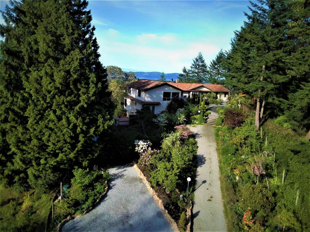 an aerial view of a house with trees and a driveway at Armand Heights in Ganges