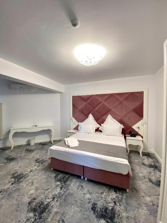 Postel nebo postele na pokoji v ubytování Hotel Simona Halep - Mamaia Nord