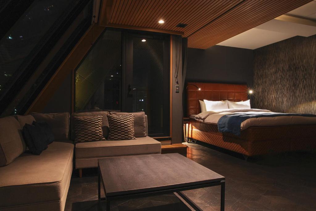 Postel nebo postele na pokoji v ubytování Asakusa Kokono Club Hotel