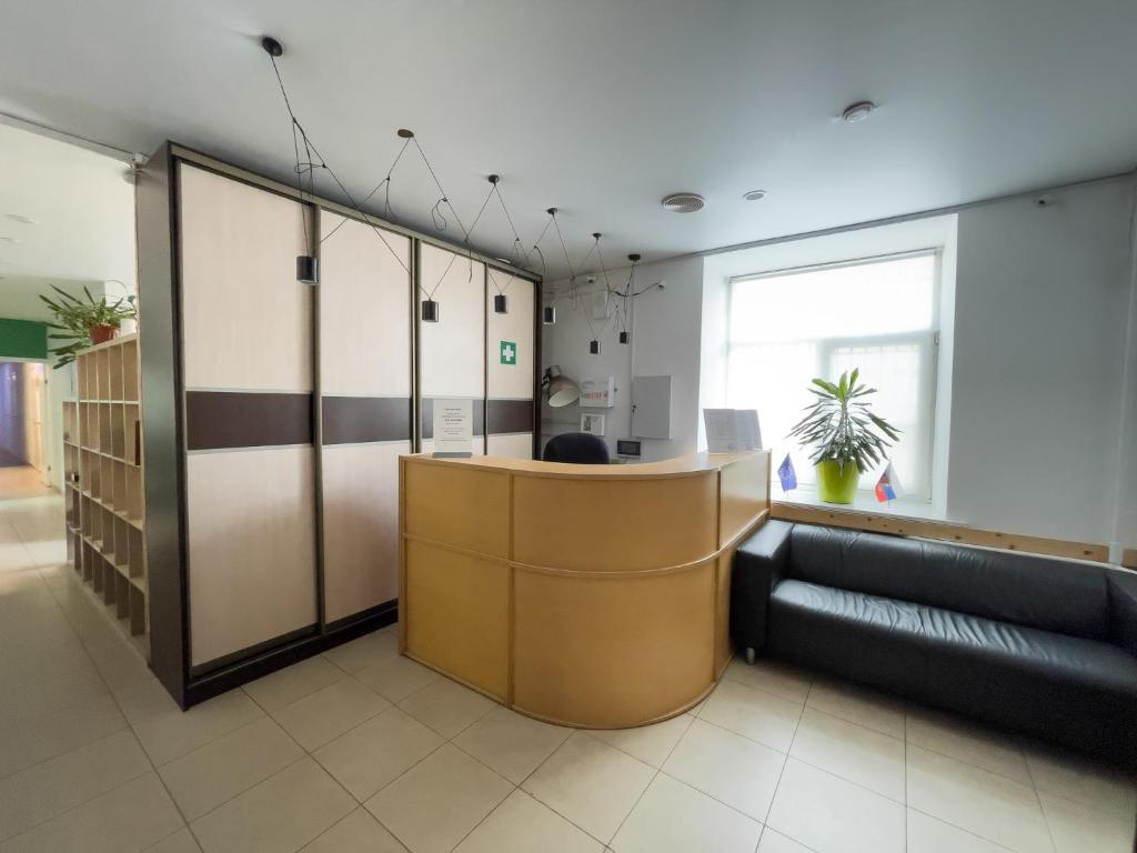 an office with a reception desk and a couch at Nice Hostel Paveletskaya in Moscow