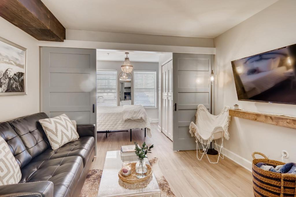 a living room with a couch and a table at First Tracks 3105 condo in Steamboat Springs
