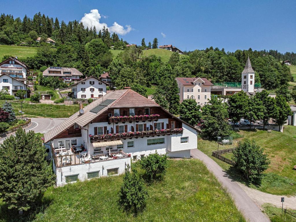 an aerial view of a house in a village at Gasthof Mesnerwirt in Auna di Sopra