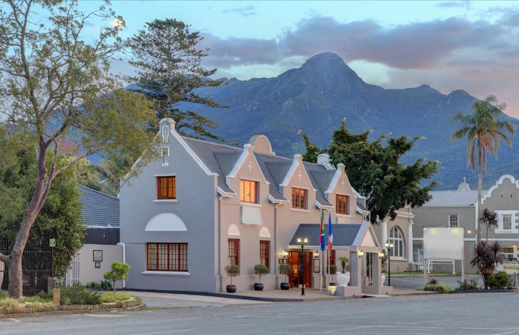 a building with a mountain in the background at Premier Express Inn George in George