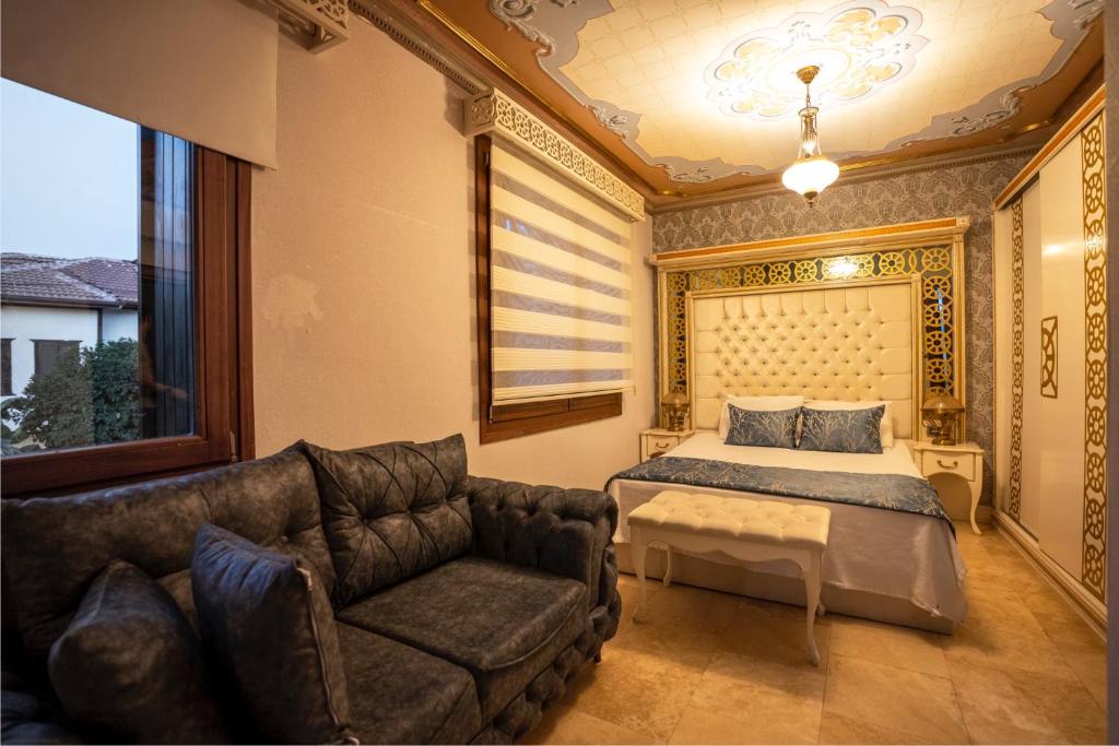 A bed or beds in a room at Castle Old Town Hotel