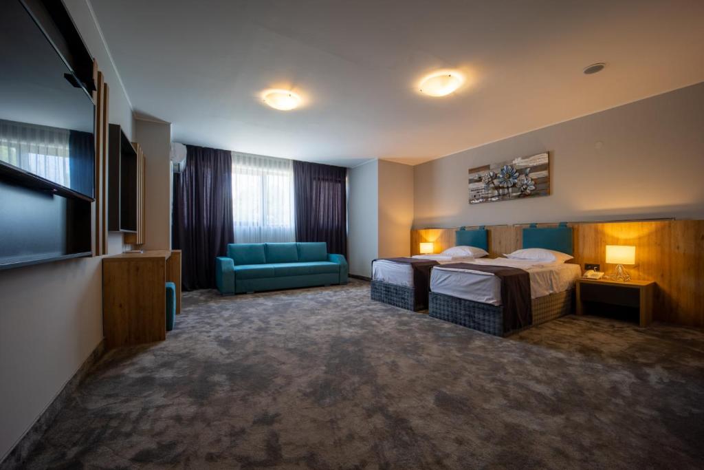 Postel nebo postele na pokoji v ubytování Hotel Caesar 2