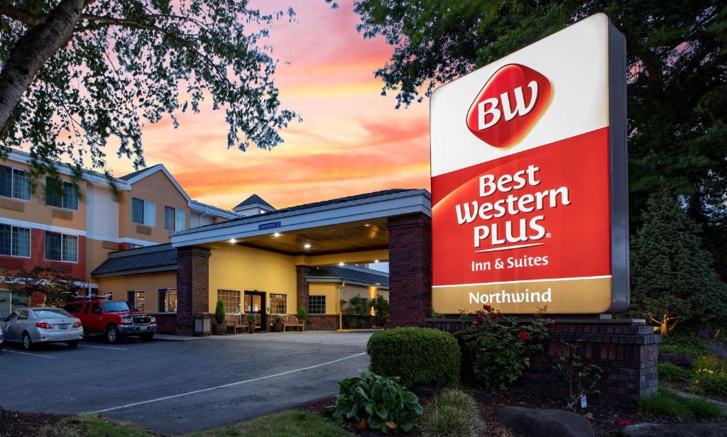 a sign for a best western plus inn and suites at Best Western Plus Northwind Inn & Suites in Tigard