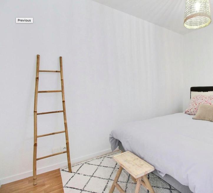 Postel nebo postele na pokoji v ubytování Les vents du sud