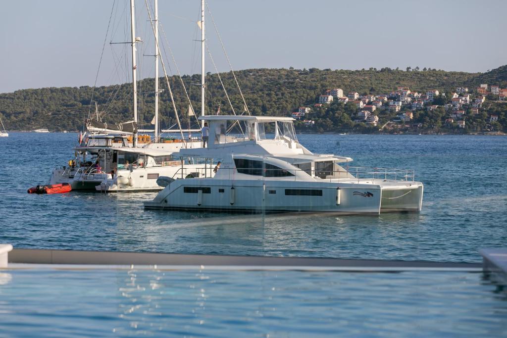 two boats docked in a body of water at Apartments Sea in Trogir