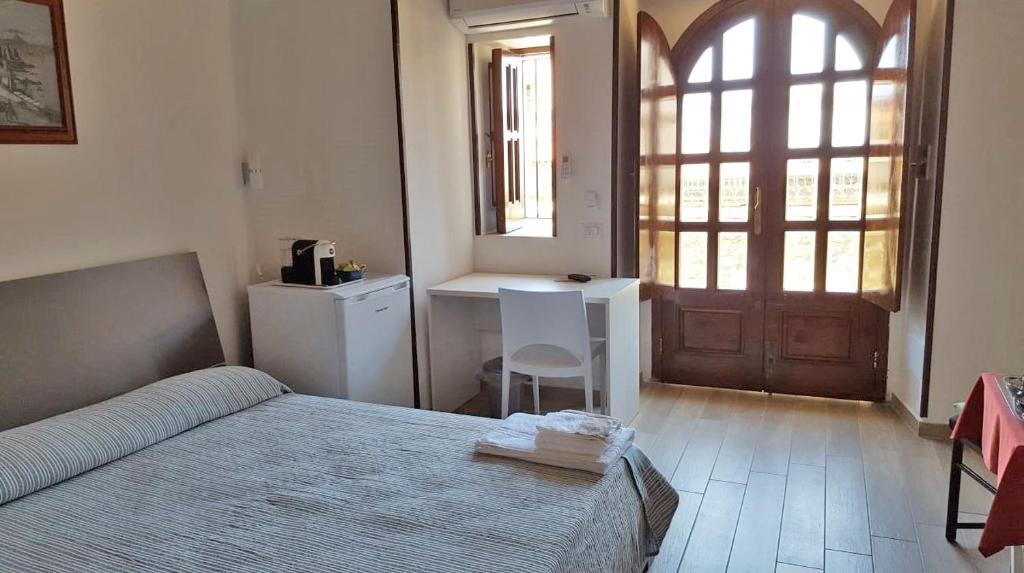 A bed or beds in a room at casa vacanze mm rooms