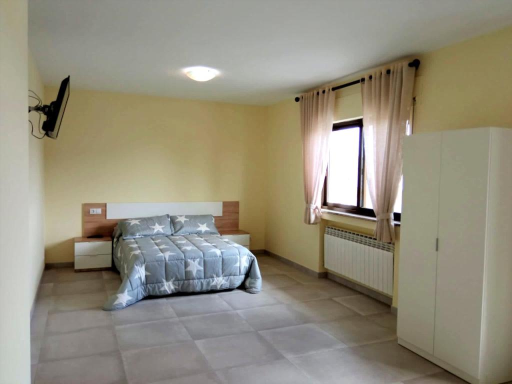 Posteľ alebo postele v izbe v ubytovaní La Villa Hostal