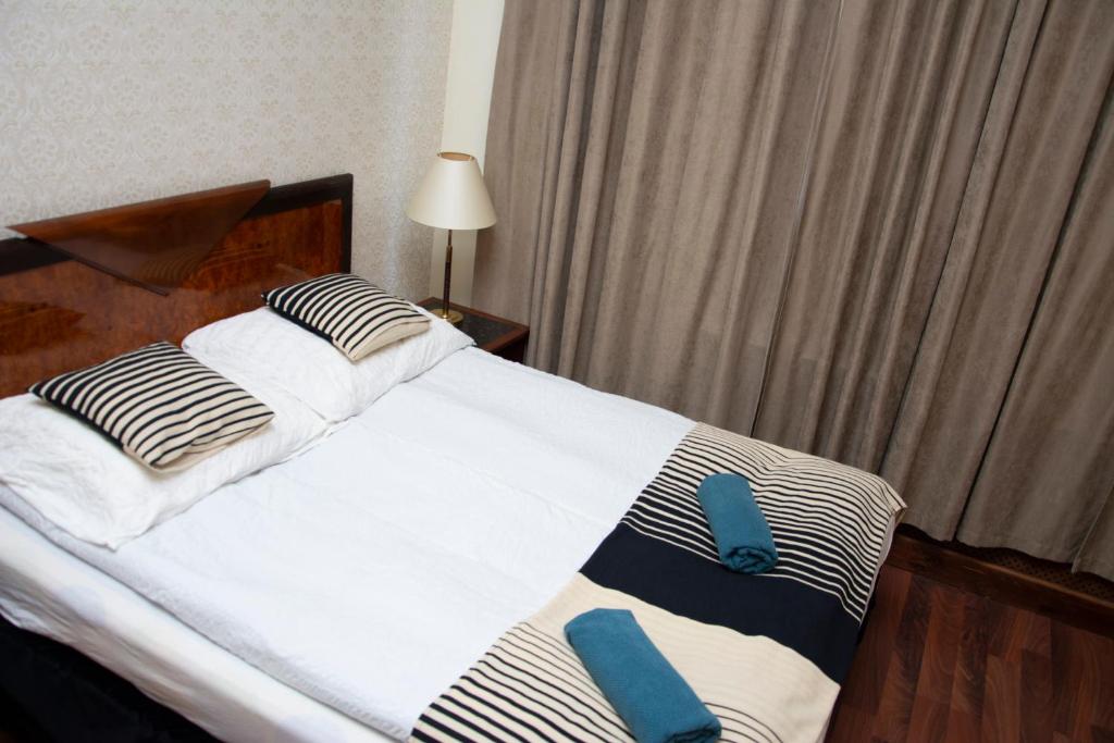 Postel nebo postele na pokoji v ubytování Evergreen Budapest Guest House