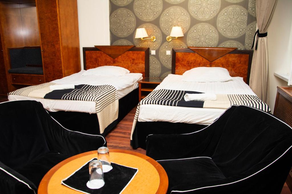 Postel nebo postele na pokoji v ubytování Evergreen Budapest Guest House