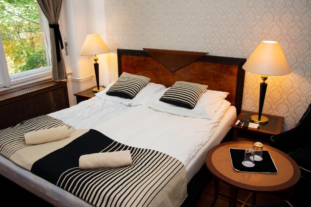 Postel nebo postele na pokoji v ubytování Evergreen Budapest Guest House