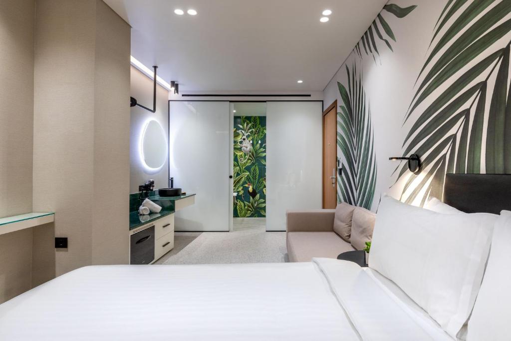 Posteľ alebo postele v izbe v ubytovaní Amazon Hotel