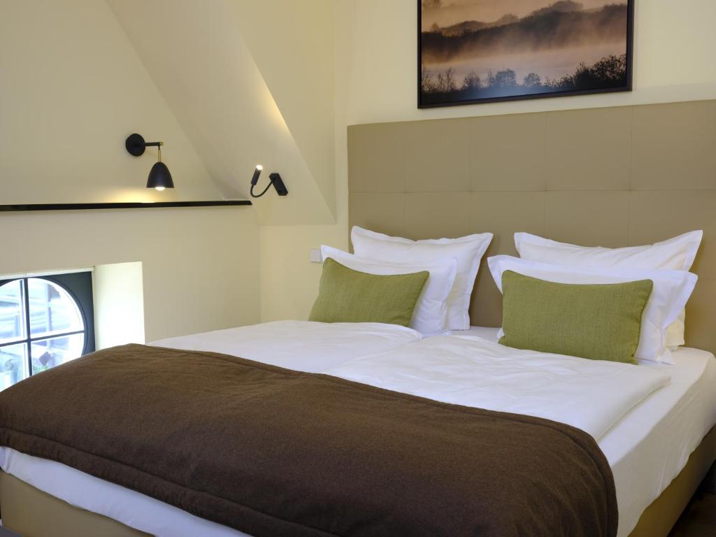 Postel nebo postele na pokoji v ubytování Farmer Hotel Basedow
