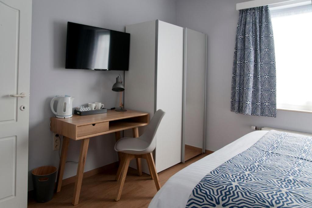 Postel nebo postele na pokoji v ubytování Wellintown Guest House