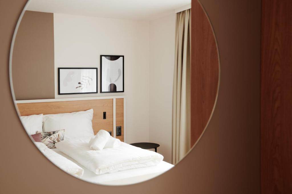 Postel nebo postele na pokoji v ubytování HOMEBOUND APARTMENTS Salzburg City I - contactless check-in