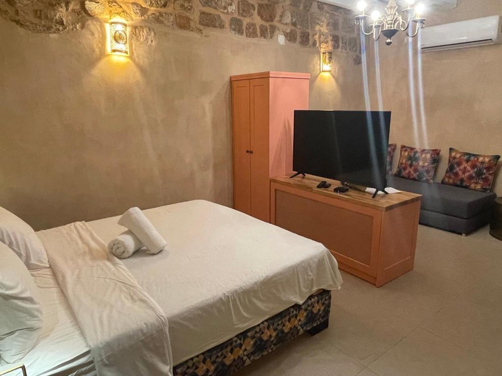 Postel nebo postele na pokoji v ubytování Arabesque House