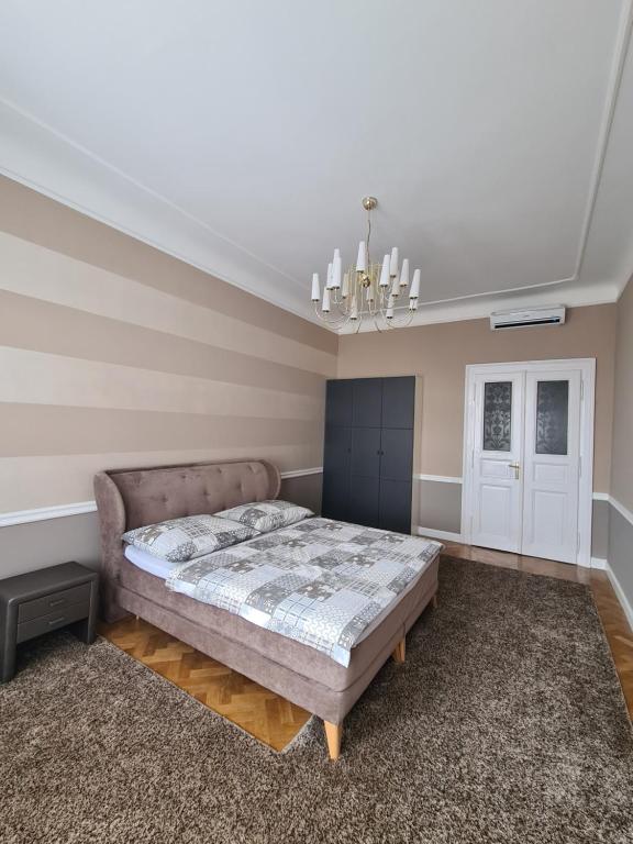 Postel nebo postele na pokoji v ubytování Deluxe apartment Slovenská