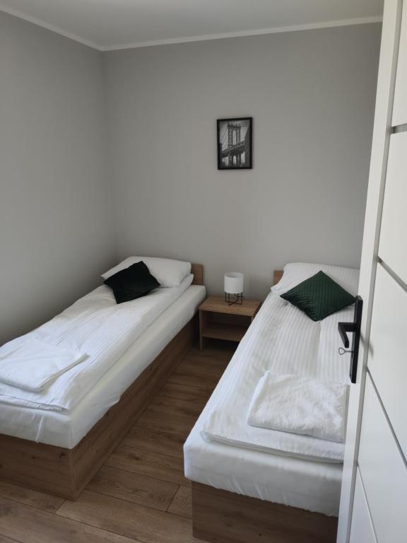 Posteľ alebo postele v izbe v ubytovaní Krollhouse Pokoje gościnne