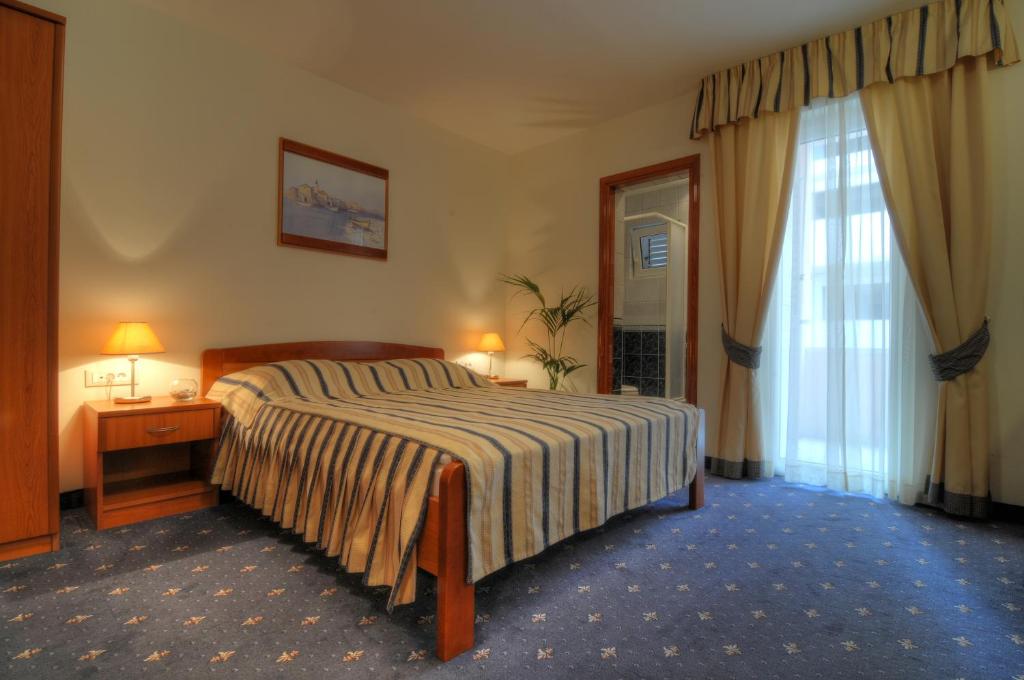 Voodi või voodid majutusasutuse Hotel Rosina toas