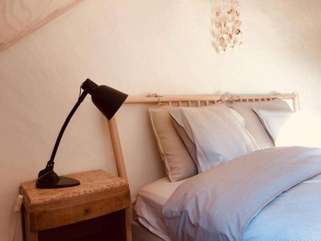 Postel nebo postele na pokoji v ubytování Logies Lapin