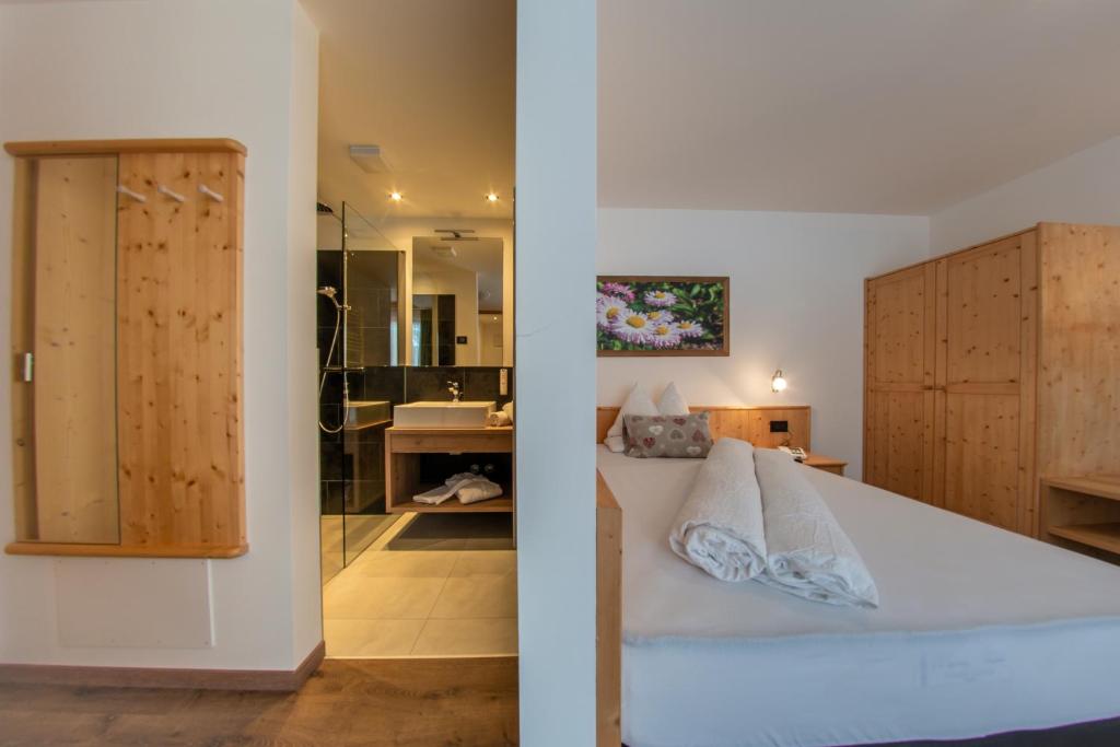 Postel nebo postele na pokoji v ubytování Hotel Gran Pre