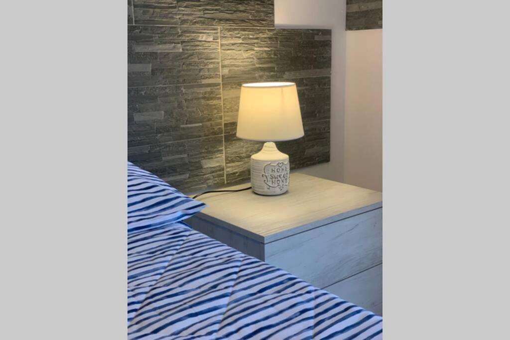 Łóżko lub łóżka w pokoju w obiekcie Casa vacanza - I Mulini con parcheggio gratuito incluso.