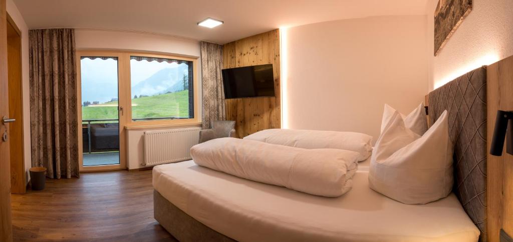 Letto o letti in una camera di Sonnenhang Montafon