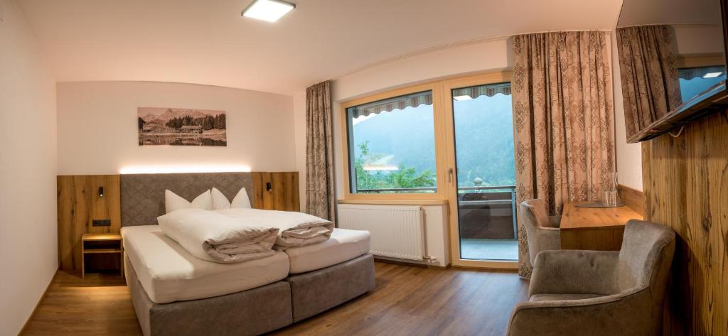 Letto o letti in una camera di Sonnenhang Montafon